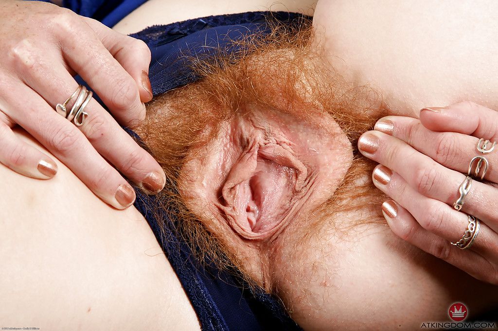 Mature redhead Ana Molly exposing her really hairy pussy for close ups