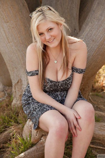 Chubby blonde teen Kylee Wilson exposing her big natural tits outdoors