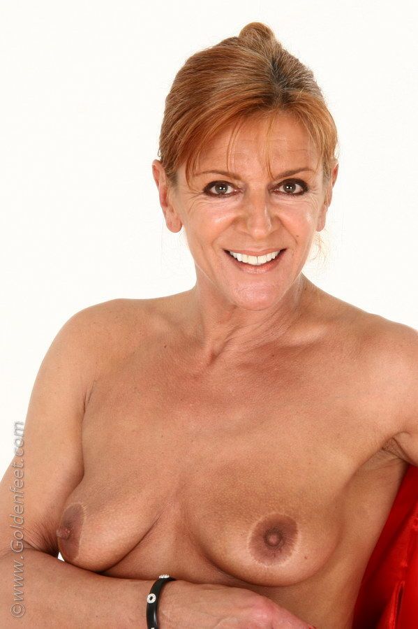 Aged Euro woman Lady Sarah fondling mature boobs while modeling pantyhose