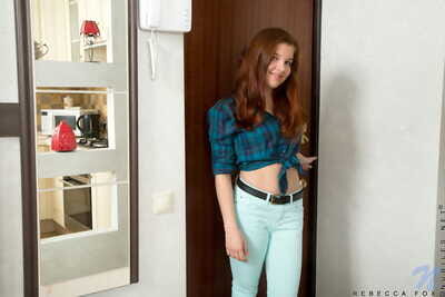 Young redhead Rebecca Fox shows her naked beauty and flexibility at once