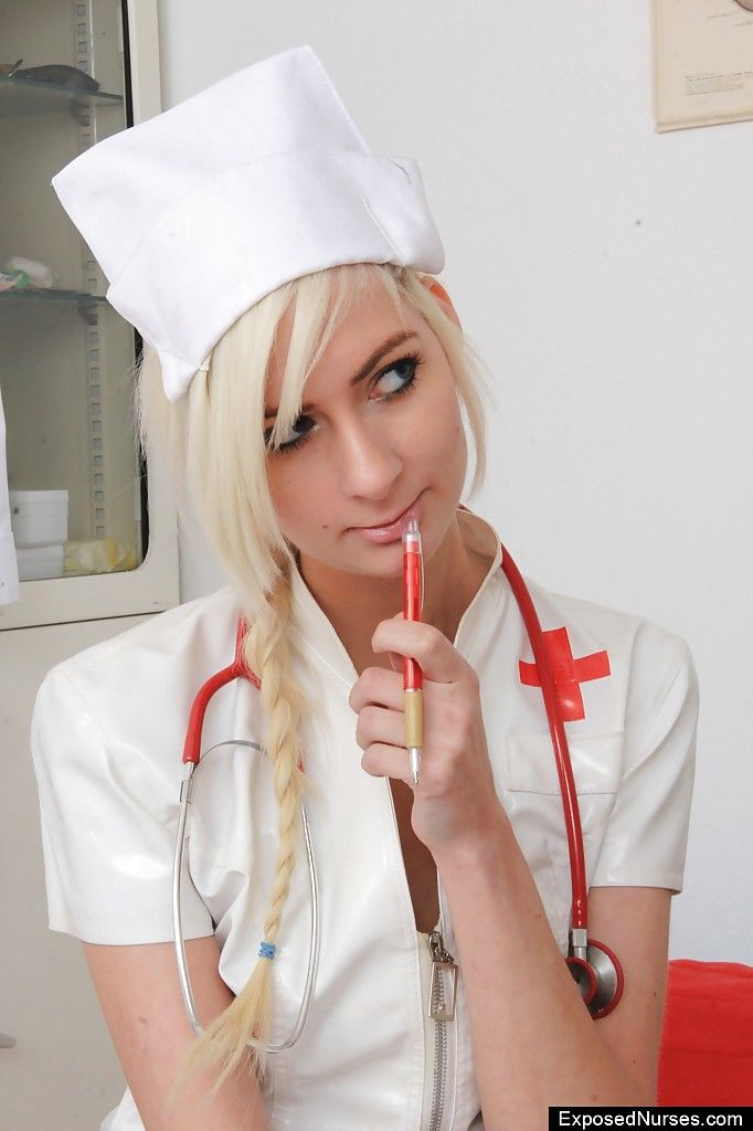 Simone is a skinny nurse that loves masturbating her shaved pussy