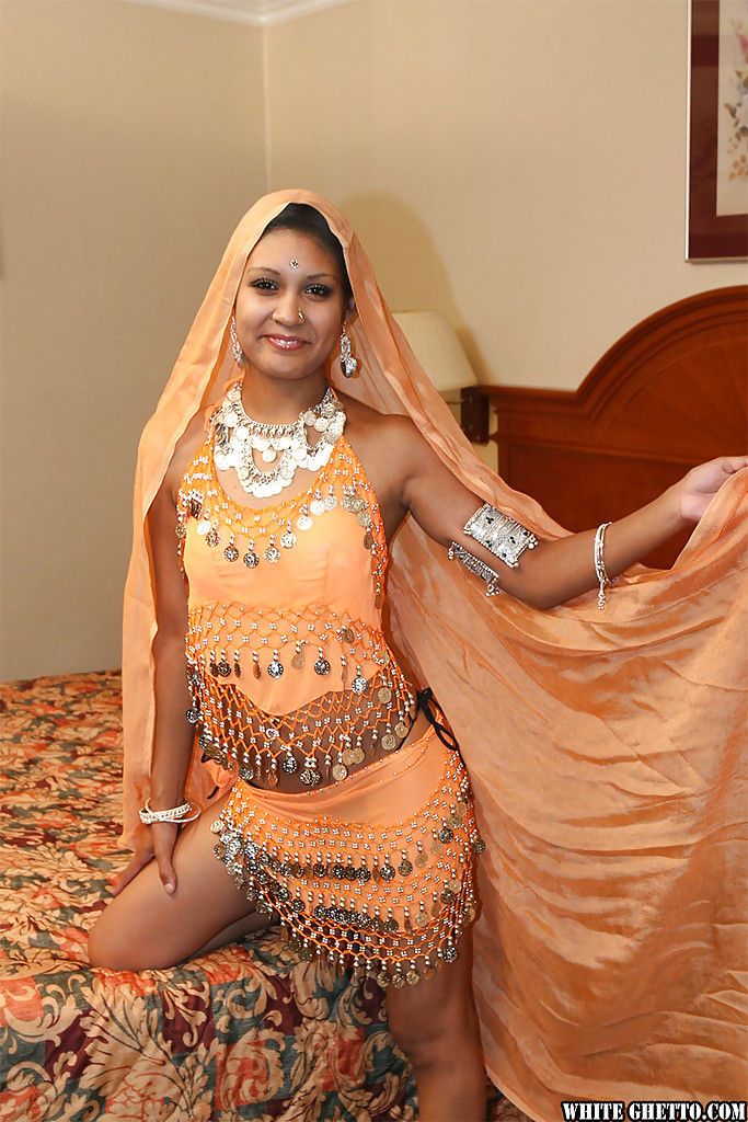 Naughty indian lady on high heels uncovering her tits and pussy