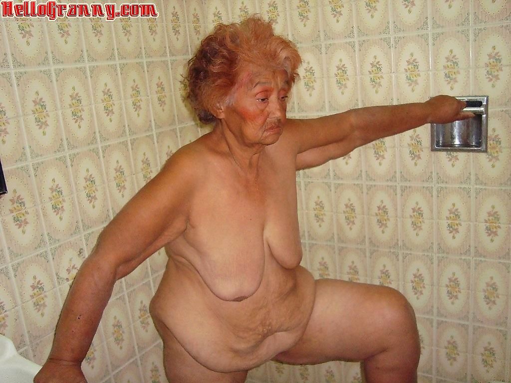 Painted granny in the shower plays with her boobs - part 3891
