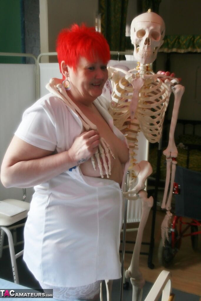 Slutty mature nurse in white stockings gets toyed up by a skeleton