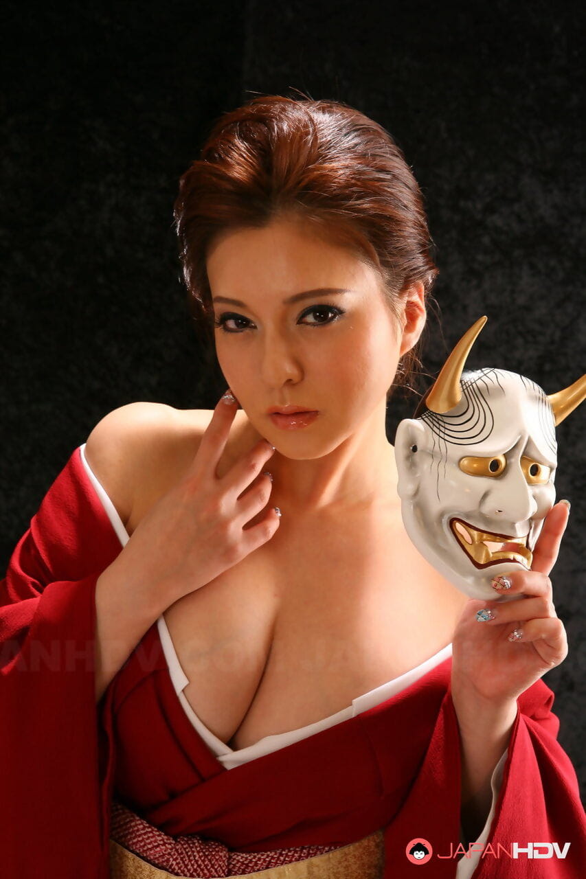 Japanese model Yuki Tsukamoto fondles her firm boobs as she gets naked