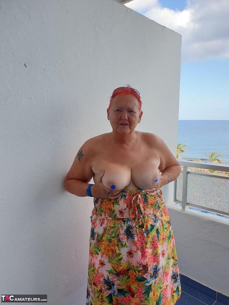 Old SSBBW Val Gasmic dyes her hair red before exposing herself on the beach