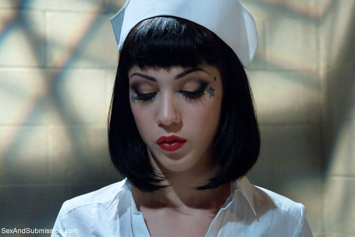 Dark haired nurse Asphyxia Noir is sexually assaulted by a male patient