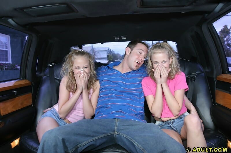 Lusty teenies give a proper sandwich blowjob on the back seat