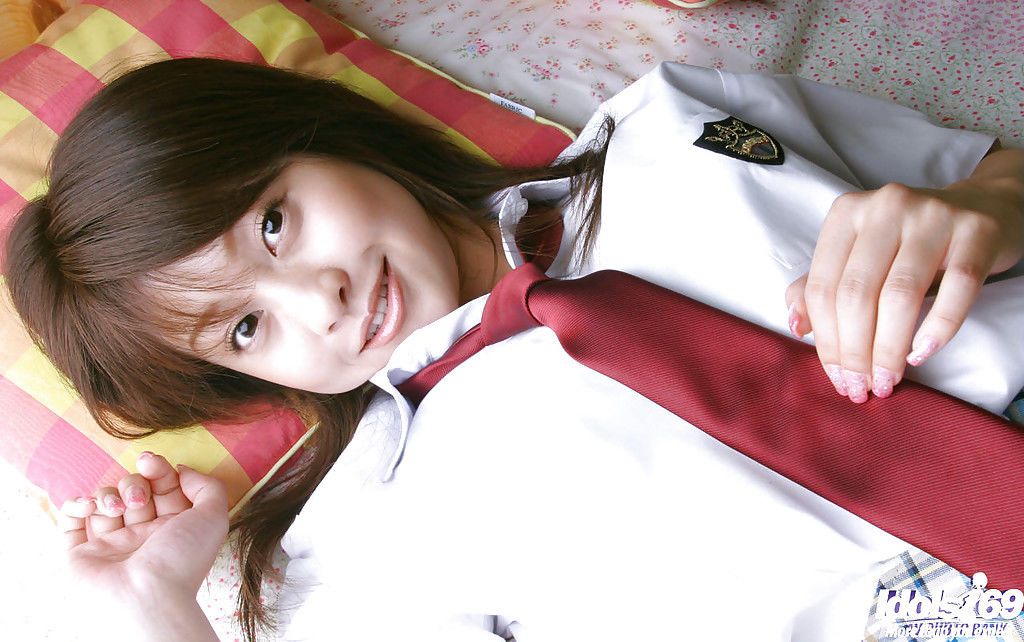 Naughty asian schoolgirl Ayumi Motomura slipping off her uniform