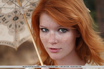 Freckled redhead Mia Sollis goes fr a nature walk completely naked