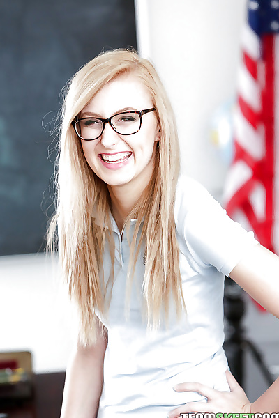 Young blonde nerd in glasses Alexa Grace posing in schoolgirl uniform